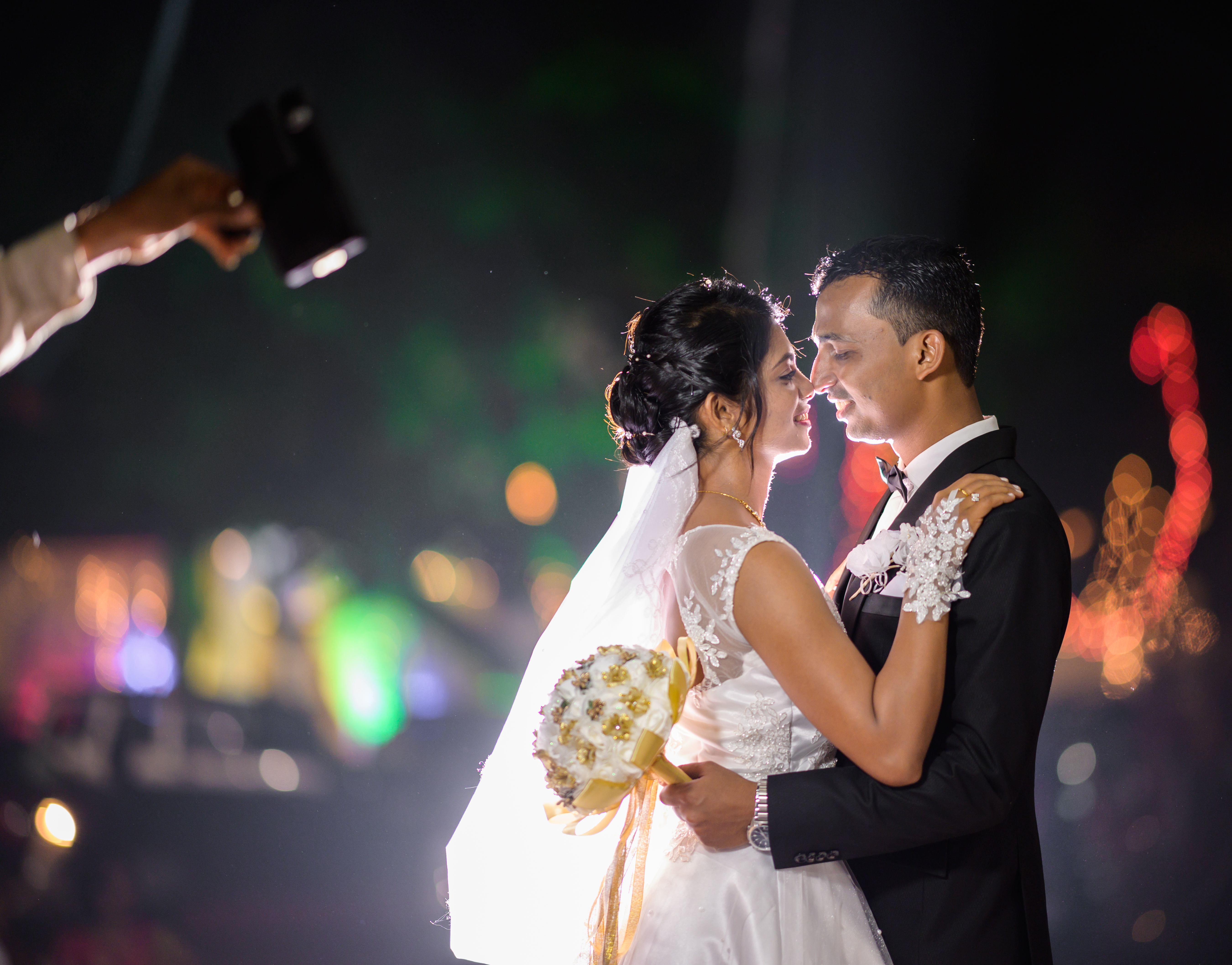 A bride and groom exchanging vows in a sunlit church